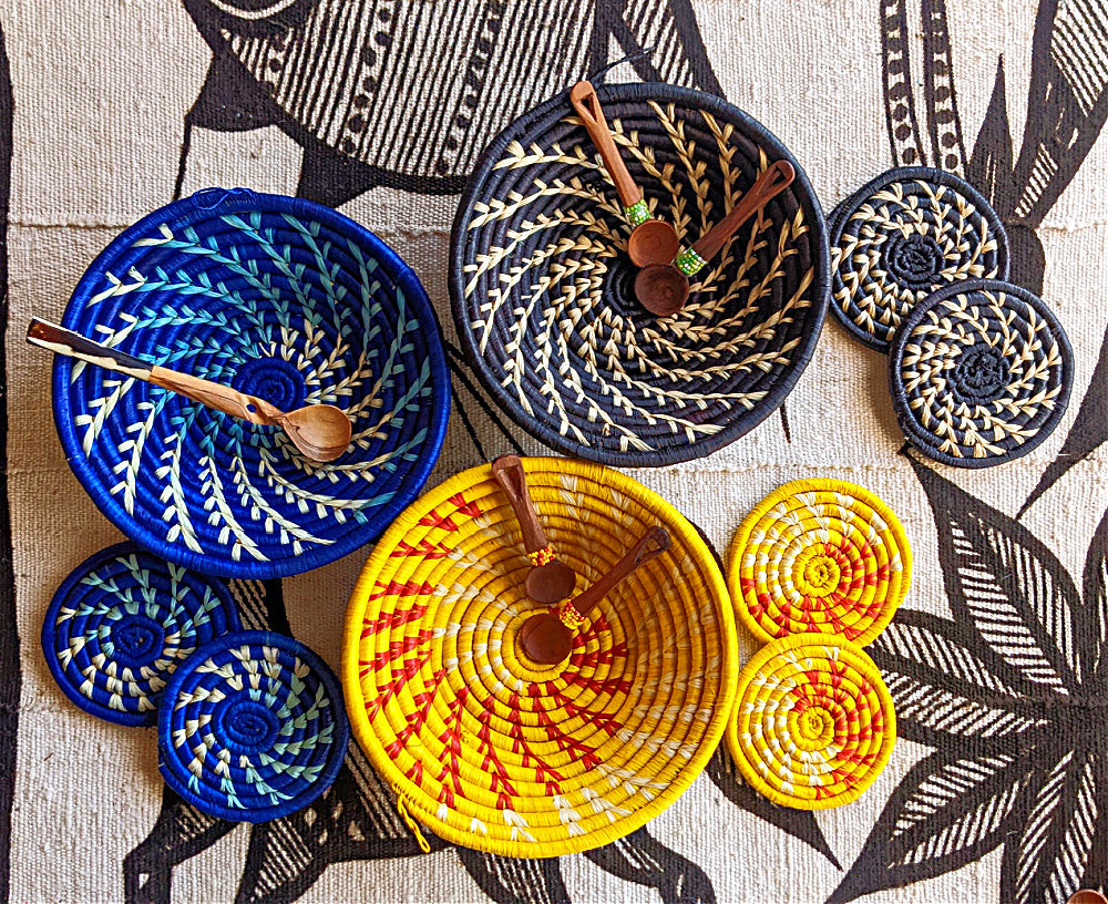 https://www.reflektiondesign.com/cdn/shop/products/african-wall-baskets-coasters-gift-set-blue-yellow-black_166a4dc3-8764-4e4b-aee3-6687ee0e3d7a_1024x1024@2x.jpg?v=1681276263